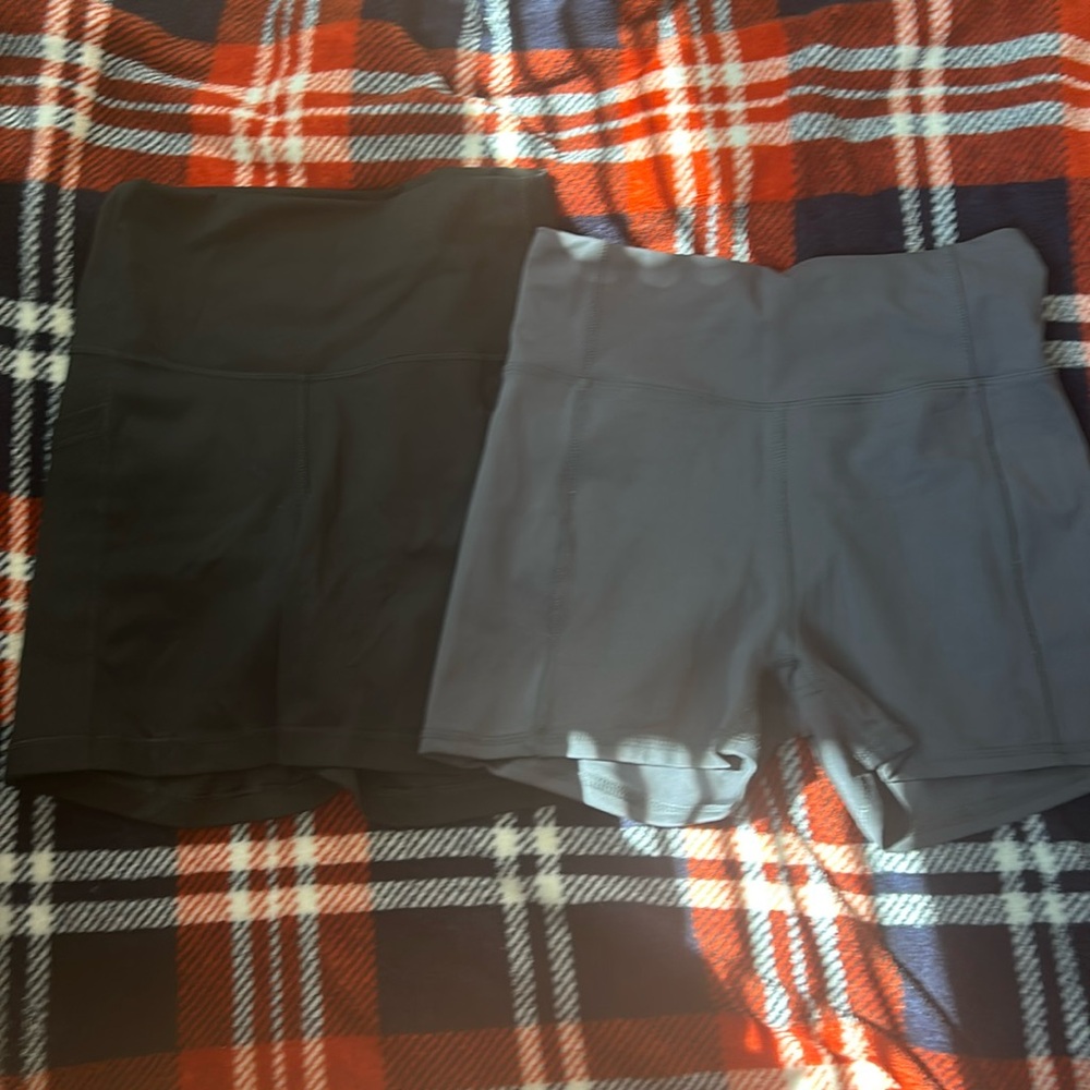 Two pairs of athletic shorts both size medium